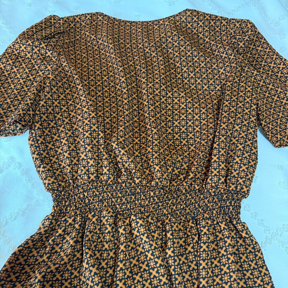 Black and copper cinch waist blouse